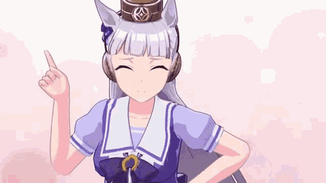 a girl in a sailor suit and headphones is pointing up with her finger .
