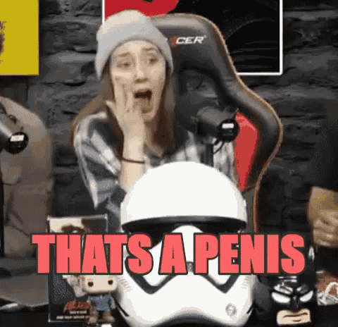 a woman sitting in a chair with a storm trooper helmet and the words that 's a penis in red