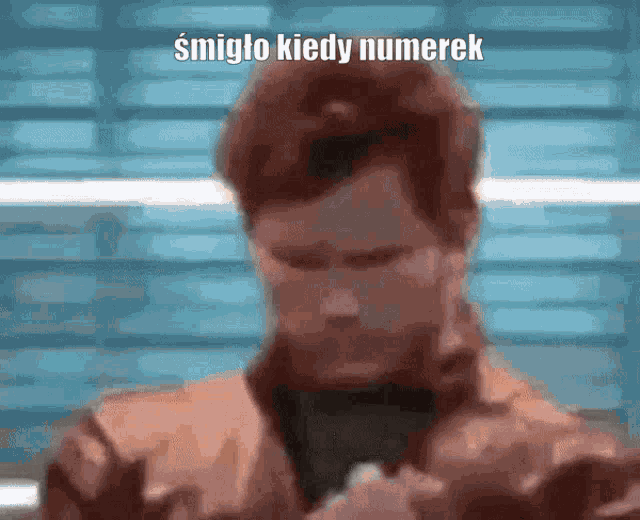 a blurry picture of a man with the words smigto kiedy numerek written above him