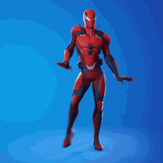 a man in a red and black spiderman costume is standing with his arms outstretched