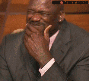 a man in a suit and tie is laughing with a sb nation logo in the background