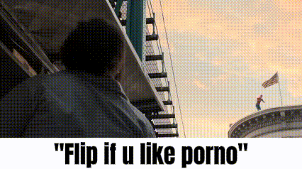 a man is standing on top of a building with the words " flip if u like porno " below him