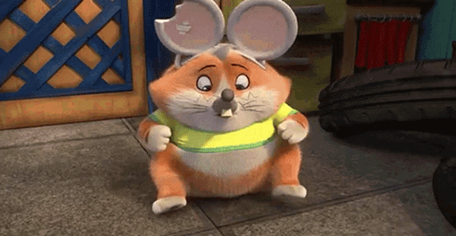 a cartoon mouse is wearing a yellow shirt and has a hole in its ear