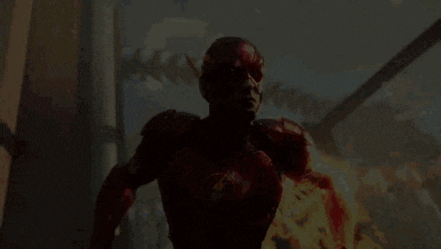 a man in a red superhero costume is running