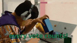 a man wearing headphones sits at a table with the words " every vote counts " on the bottom