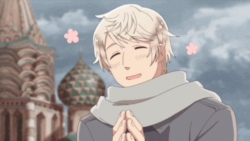 a man with a scarf around his neck is smiling with a pink flower in his hair