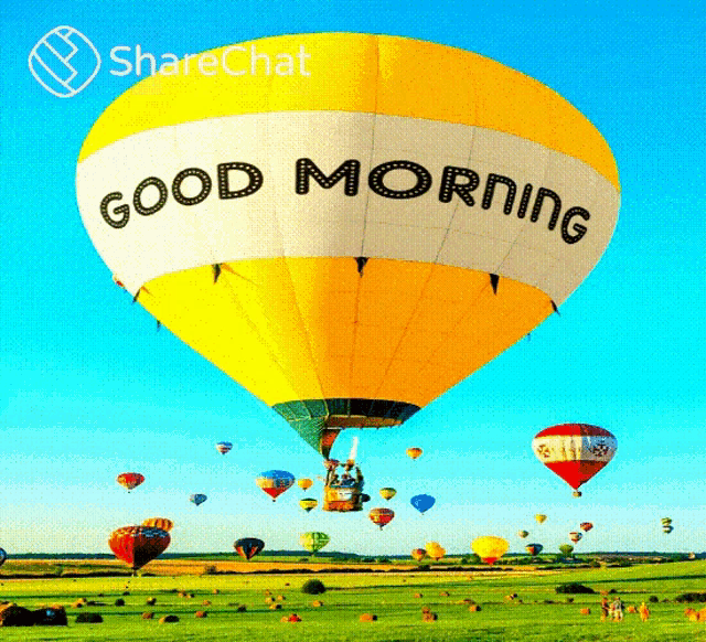 a yellow hot air balloon with the words good morning written on it