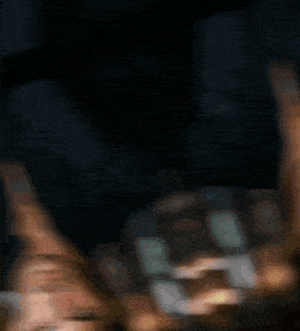 a blurry picture of a man 's face in a black shirt
