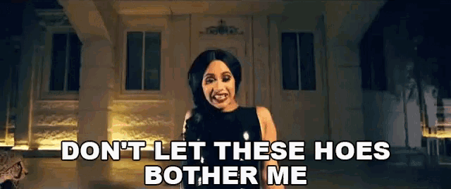 a woman in a black dress is standing in front of a house with the words `` don t let these hoes bother me ''