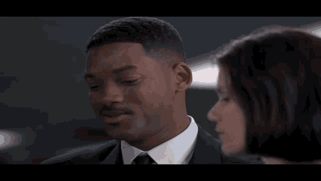 a man in a suit has a yellow sticker on his face that says pффf
