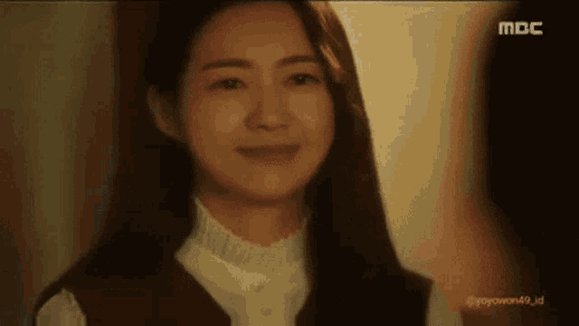 a close up of a woman 's face with a man 's face in the background .