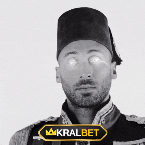 a man in a military uniform is standing in front of a banner that says kralbet