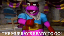 a cartoon character is wearing boxing gloves and a blue shirt and says the murray 's ready to go .