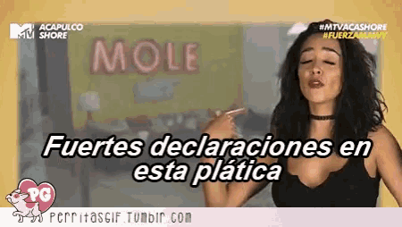 a woman pointing at a sign that says mole on it