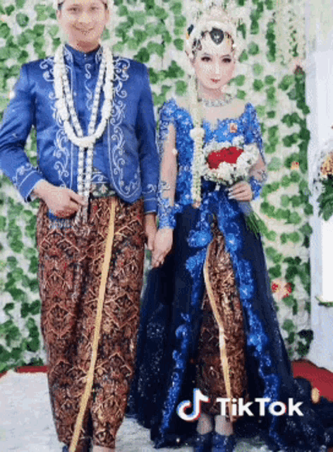 a bride and groom are posing for a picture with tiktok written on the bottom right