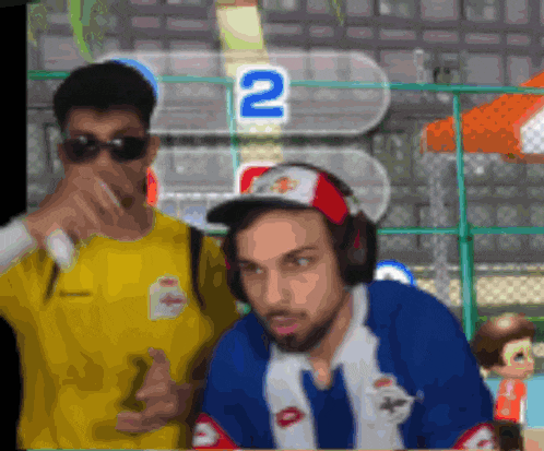 two men are playing a video game with the number 2 on the screen behind them
