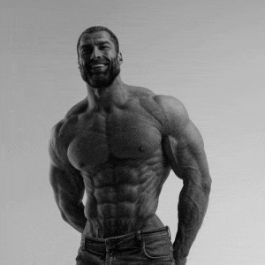 a black and white photo of a shirtless muscular man with a beard smiling .