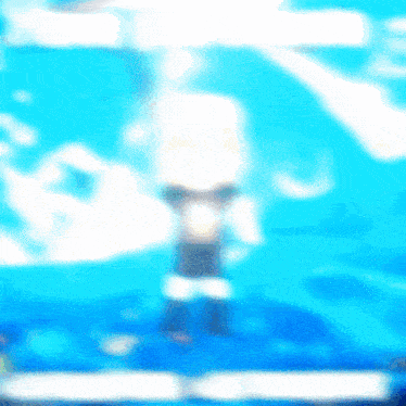 a blurry picture of a person standing in front of a blue sky