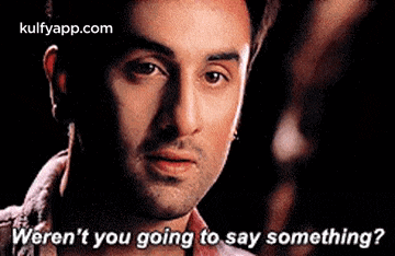 a man is looking at the camera with the words `` weren 't you going to say something ? ''