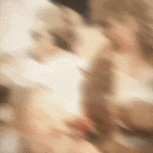 a blurry picture of a person 's face with a few lines visible
