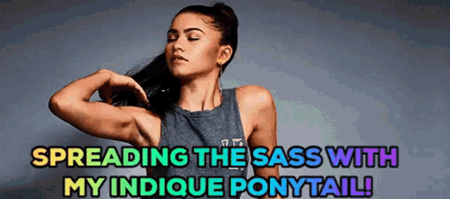 a woman in a tank top is spreading the sass with her indicque ponytail .