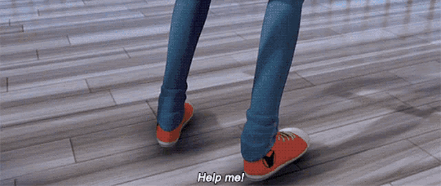 a person standing on a wooden floor with help me written on the floor
