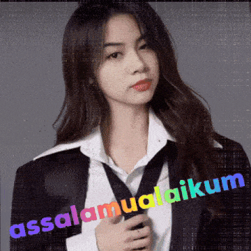 a woman in a suit and tie with the words assalamualaikum on the bottom right