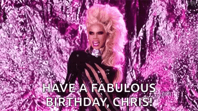 a drag queen is standing in front of a pink background and saying `` have a fabulous birthday , chris '' .