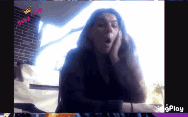 a screen shot of a woman with the words becky boop on the top
