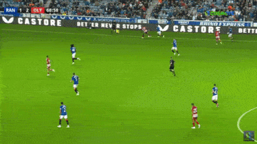 a soccer game is being played on a field with advertisements for 32red and aim