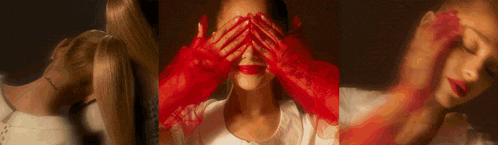 a woman wearing red gloves is covering her eyes .