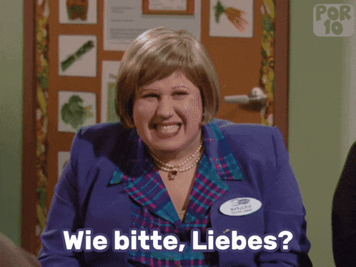 a woman in a purple suit is laughing and says wie bitte liebes