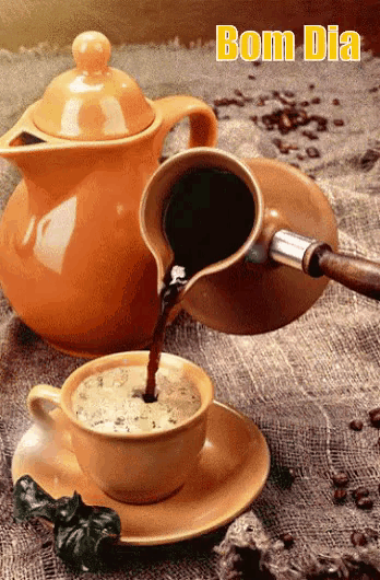 a cup of coffee is being poured into a saucer with bom dia written on the top