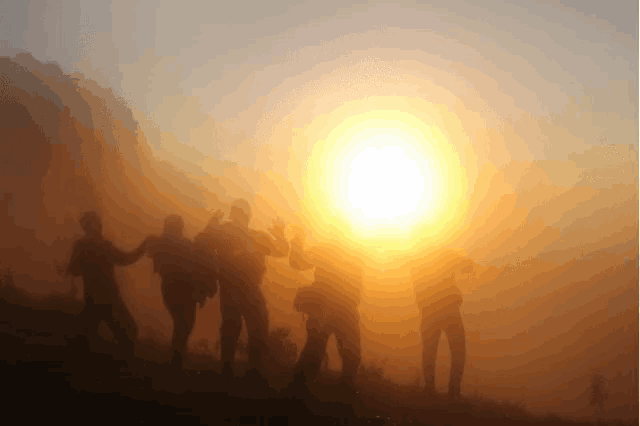 a group of people standing in front of a sun
