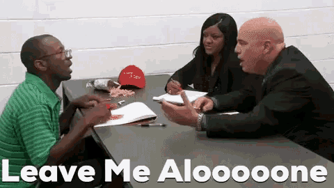 a group of people sitting at a table with the words leave me aloooone written on the bottom