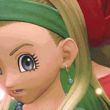 a close up of a girl 's face with a green headband and earrings