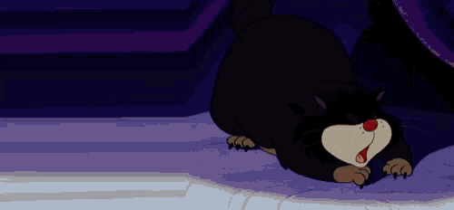 a cartoon cat is laying down with its mouth open
