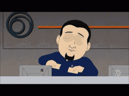 a cartoon character from south park is sitting at a desk with a computer monitor