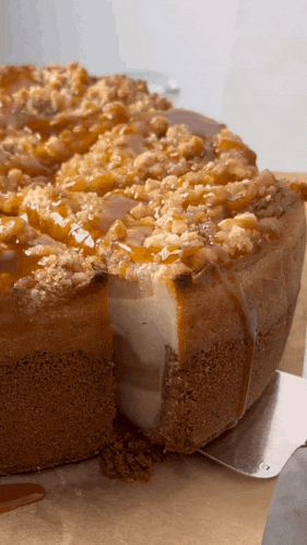 a close up of a cheesecake with a slice taken out