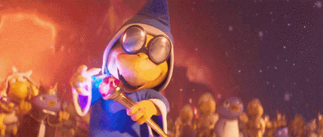 a cartoon character is wearing a blue robe and holding a microphone in front of a crowd .