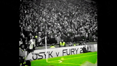 a soccer field with a sign that says ' usik v fury ' on it