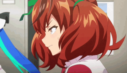 a close up of a girl with red hair and a green ribbon in her hair