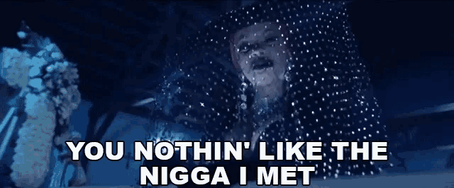 a man in a cowboy hat is surrounded by snow and the words you nothin ' like the nigga i met
