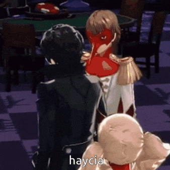 a man and a woman are standing next to each other and the woman is wearing a red mask and saying haycia