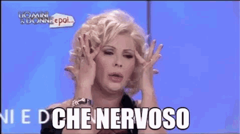 a woman in a wig is making a funny face and saying " onnche nervoso "