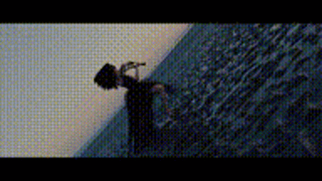 a person is standing on a staircase holding a microphone