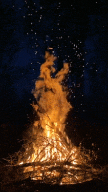 a poster with a fire and the words evrensel muzik dostlari on it