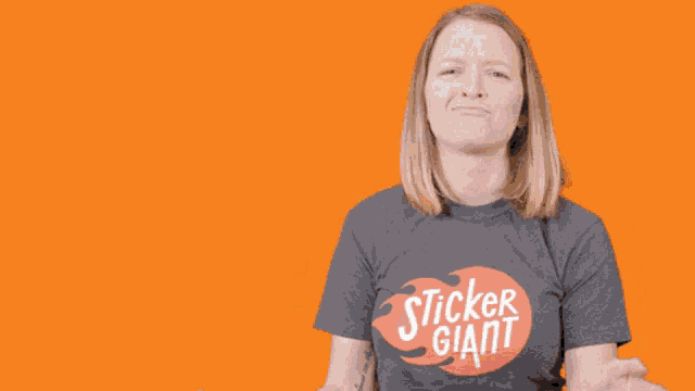 a woman wearing a shirt that says sticker gia applauds