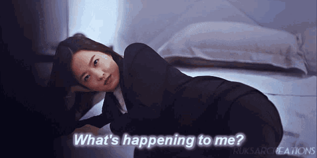 a woman laying on the floor with the words " what 's happening to me "