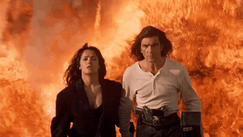 a man and a woman are running from a fire